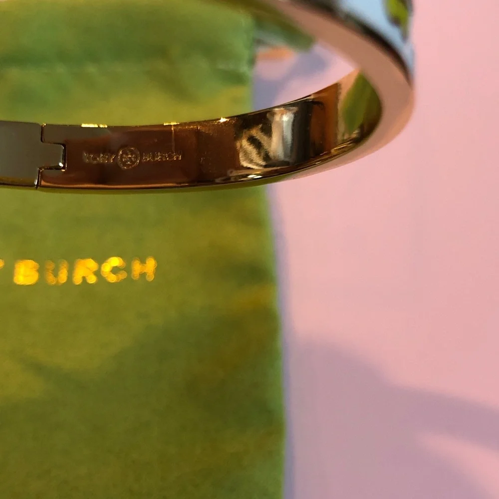 Authentic Tory Burch New/tag and pouch. Enamel Floral Hinge gold tone bracelet.